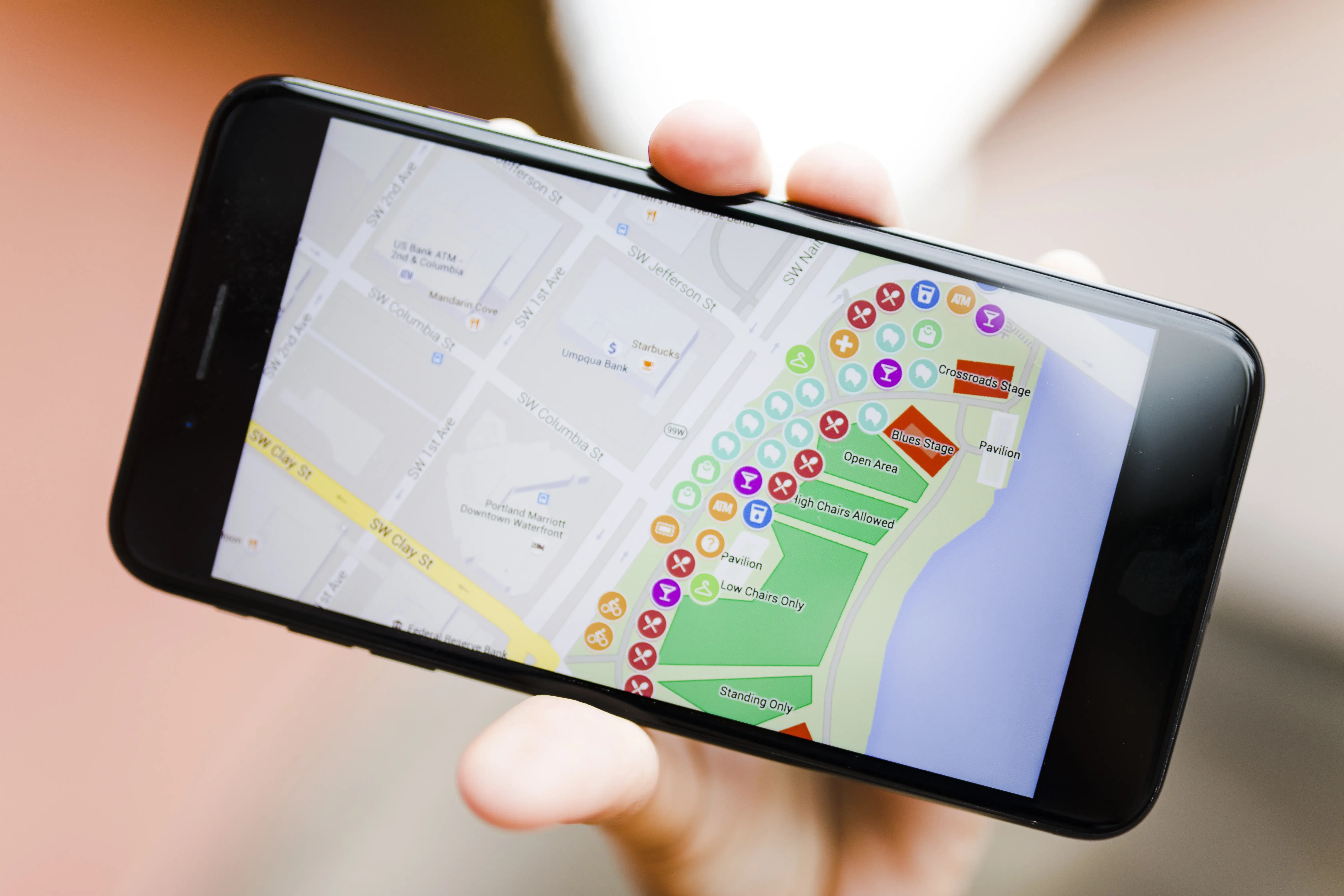 close-up-person-s-hand-holding-smartphone-with-map-gps-navigation.webp